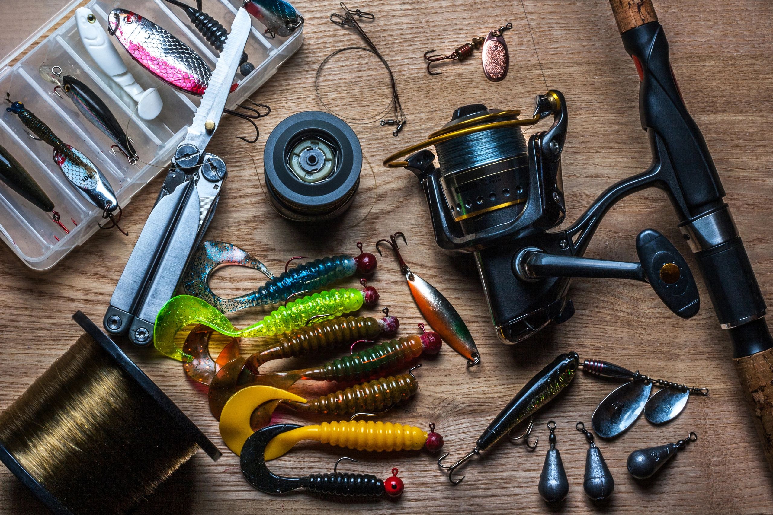Fishing rod and tackle laid out as a background